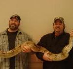 MATT & BJ HOLDING A GIANT SNAKE AT THE ST. CHARLES BOAT SHOW. YOU WOULDN'T KNOW MATT HATES TO TOUCH A SNAKE!!